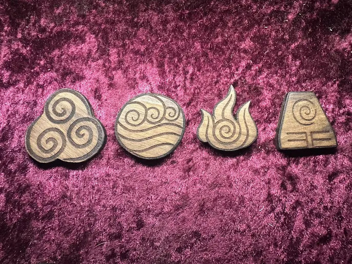 Set of four Avatar element pins in Royal Caribbean Chechen hardwood