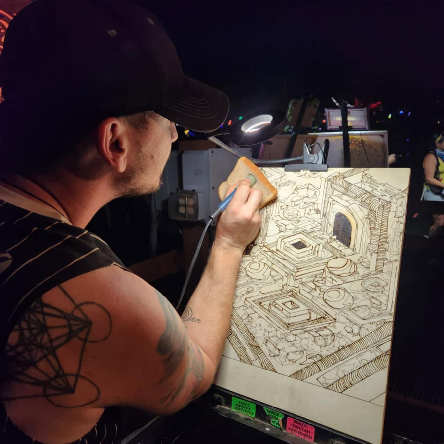 Burning an isometric design by lamplight